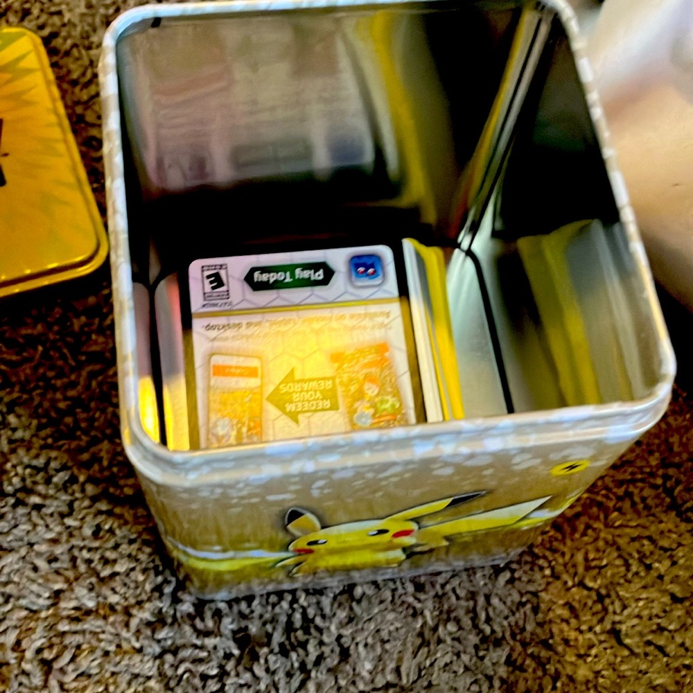 Pokemon tin with 50 cards